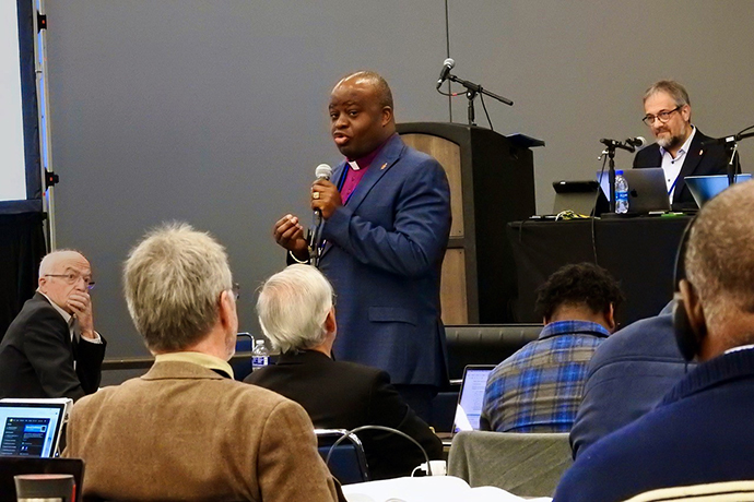 Bishop Mande Muyombo addresses the Standing Committee on Central Conference matters during an April 22 meeting in Charlotte, N.C. The committee met just ahead of General Conference, deciding whether to advance petitions dealing with the denomination’s work in Africa, Philippines and Europe. Photo by Sam Hodges, UM News.