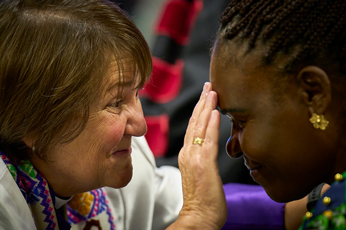During the opening worship service of the United Methodist General Conference in Charlotte, N.C., on April 23, Bishop Karen Oliveto blesses a delegate during a period in which participants were encouraged to remember their baptism. Photo by Paul Jeffrey, UM News.