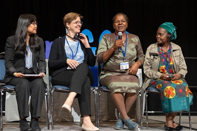 Panelists take part in a briefing for female delegates from outside the U.S. in preparation for the long-delayed United Methodist General Conference in Charlotte, N.C. From left are Jenn Ferariza Mendes and the Revs. Anne Detain, Hortencia Lange Bacela and Eva Cosme. The briefing was hosted by United Women in Faith and the United Methodist Commission on the Status and Role of Women. Photo by Mike DuBose, UM News.