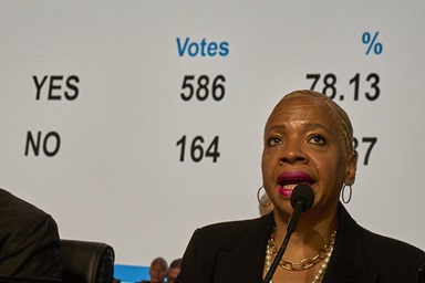 Bishop Tracy Smith Malone surveys the results of a delegate vote in favor of a Worldwide Regionalization plan as she presides over a legislative session of the United Methodist General Conference in Charlotte, N.C., on April 25. The body voted 586 to 164 for an amendment to the denomination’s constitution that will now go before annual conference voters for potential ratification. Photo by Paul Jeffrey, UM News.