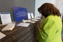 Norma Villagrana of the Western North Carolina Conference prays at an altar in the General Conference prayer room in Charlotte, N.C. The “Cultivating the Garden of the Heart” prayer room is sponsored by The Upper Room and includes prompts and Scriptures in Portuguese, Korean, French, Spanish and Kiswahili. Photo by Mike DuBose, UM News.