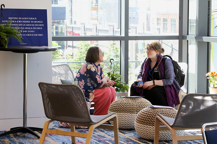 Upper Room spiritual director Susan Heafner-Heun (left) and Sarah Veles of the Western North Carolina Conference have a conversation in one of the eight meditative areas provided in the prayer room at the Charlotte Convention Center at the United Methodist General Conference. Photo by the Rev. Thomas Kim, UM News.