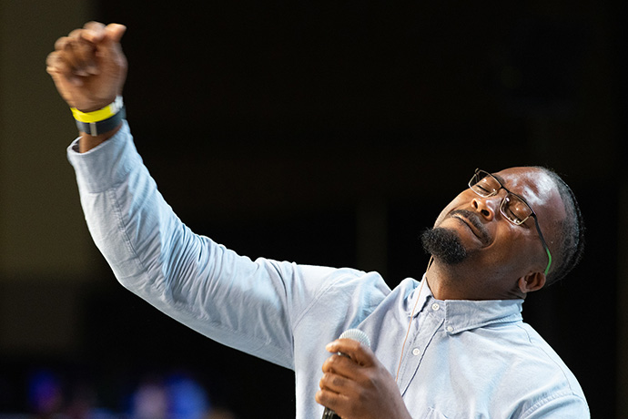 Christopher Raleigh sings during morning worship at the United Methodist General Conference in Charlotte, N.C. Raleigh is lead worship singer at Light of Christ United Methodist Church in Charlotte. Photo by Mike DuBose, UM News.