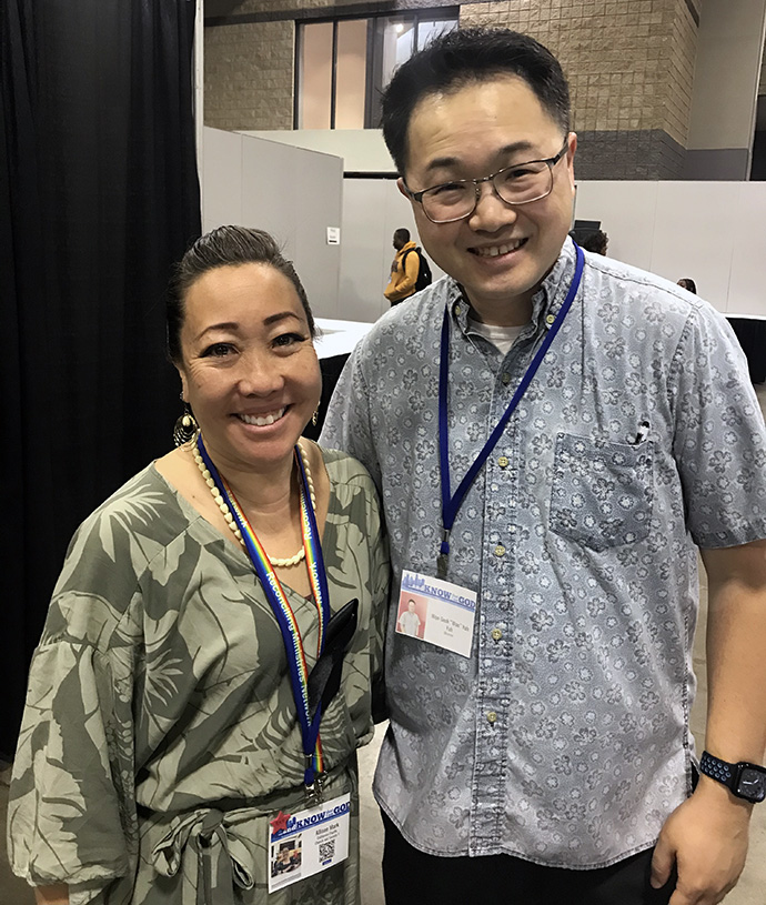 The Revs. Allison Mark and Won-Seok Yuh are among those pleased by General Conference’s approval of an apology for the church’s role in the 1893 overthrow of the Hawaiian monarchy. Photo by Sam Hodges, UM News. 