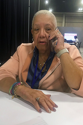 Jennifer Davis, a Western North Carolina Conference delegate to General Conference, speaks to a Charlotte-Mecklenburg Police Department friend after learning multiple law enforcement officers were victims in an April 29 mass shooting on Charlotte's east side. UM News photo by Sam Hodges.