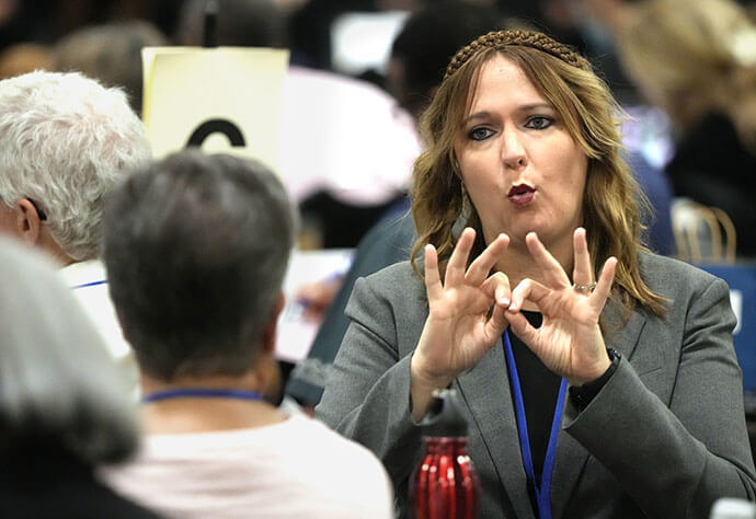 Lara Wagner interprets using American Sign Language during the United Methodist General Conference in Charlotte, N.C., on April 30. Photo by Larry McCormack, UM News.