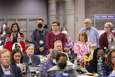 Members of the Wisconsin and Northern Illinois delegations stand while an apology for sexual misconduct within The United Methodist Church is read during the final day of the United Methodist General Conference in Charlotte, N.C., on May 3. Photo by Mike DuBose, UM News.
