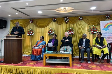 The Rev. Asir Ebenezer, general secretary of the National Council of Churches in India, speaks to the opening session of the “Gender and Sexual Diversities and the Faith Communities” seminar at the Methodist Educational Center in Chennai, India, on Jan. 19. From left to right are Bishop E. D. Yesurathnam, Chennai Area of The Methodist Church of India; Dr. V. Esther Kathiroli, executive secretary of the Tamilnad Christian Council; the Rev. Donald E. Messer, executive director of the Center for Health and Hope; Dr. N. M. Samuel, executive director of The C.A.R.E. Foundation in Namakkal, India; and Inba Ignatius, who has initiated a church ministry primarily with transgender members. Photo courtesy of the Rev. Donald E. Messer.