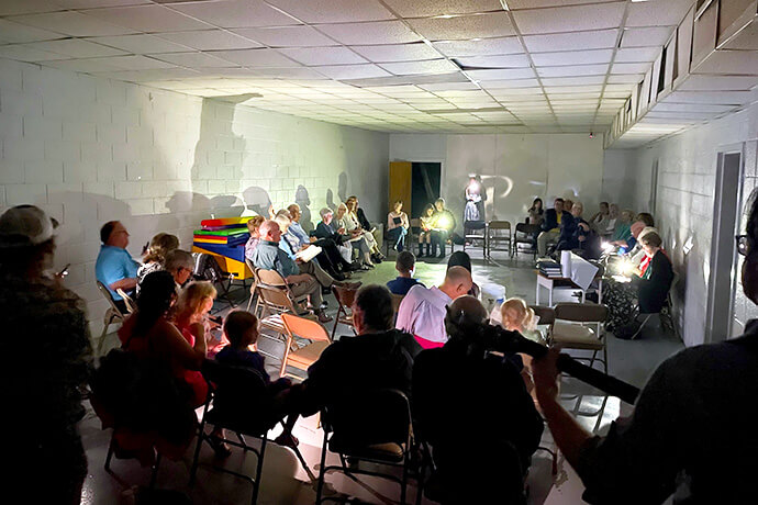 Members of Russellville Temple United Methodist Church in Kentucky worship using a generator after morning storms knocked out the church facility’s power. Later the same day, the church served as a shelter for 39 people as another storm came roaring through the state. Photo courtesy of the Kentucky Conference.