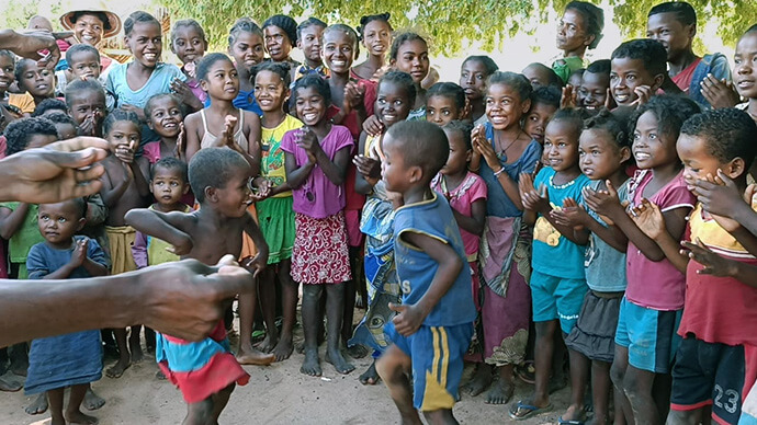 Children perform a traditional dance as a sign of gratitude to volunteers from The United Methodist Church who brought them food in Andranokaky, Madagascar. Members of Ambodifasika United Methodist Church, the first United Methodist church on the island nation, traveled more than 500 miles to deliver the aid. Photo by Justin Rakotoarimanana.