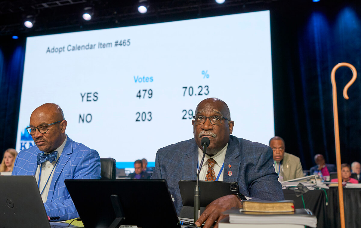 West Ohio Conference Bishop Gregory V. Palmer (right) and parliamentarian Maurice S. Henderson view results from a May 3 vote at the United Methodist General Conference in Charlotte, N.C. The measure removed prohibitions on clergy performing same-sex weddings in their churches. United Methodist News has compiled a list of the legislation passed by this year’s General Conference. Photo by Paul Jeffrey, UM News.