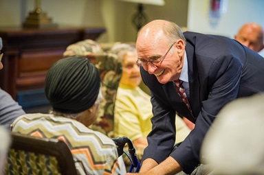 After worship services in the Bethany memory care unit, retired United Methodist Bishop Kenneth Carder goes around the room, greeting each resident by name. Carder was as interim chaplain at Bethany, part of the Heritage at Lowman senior community near Columbia, S.C. 2016 file photo by Matt Brodie.