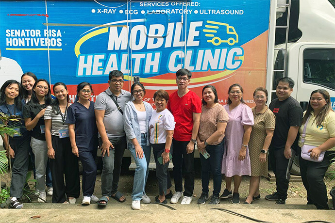 Members of the medical mission team pose in front the Mobile Health Clinic where X-rays and ultrasounds were done during a free health care outreach event at Spottswood Methodist Center in Kidapawan, Philippines, June 21-22. Photo courtesy of Davao Episcopal Area Communications.
