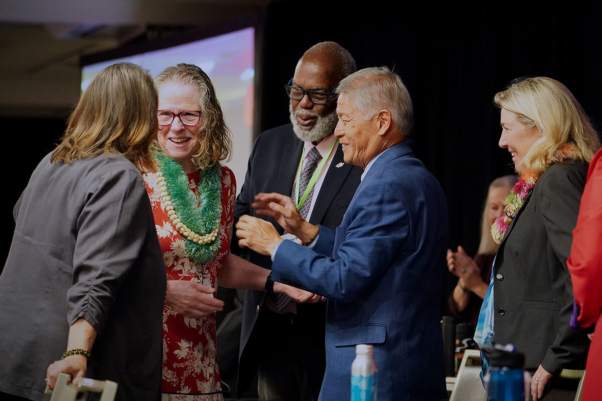 Leaders of the Western Jurisdiction greet the Rev. Sandra K. Olewine (second from left) as she takes the stage after being elected a United Methodist bishop during the jurisdictional conference July 12 in Spokane, Wash. She was elected on the 17th ballot. Photo by Patrick Scriven, Western Jurisdiction.