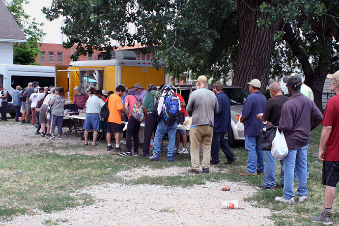 On most Wednesdays, from 70 to 120 low-income people, most of whom are unsheltered, come to 1200 S. Walker in Oklahoma City for a nutritious lunch as part of the Ice Angels ministry, a network of local churches and nonprofits. Gently used clothing is also provided for those who need it. Photo by Boyce Bowdon, UM News. 