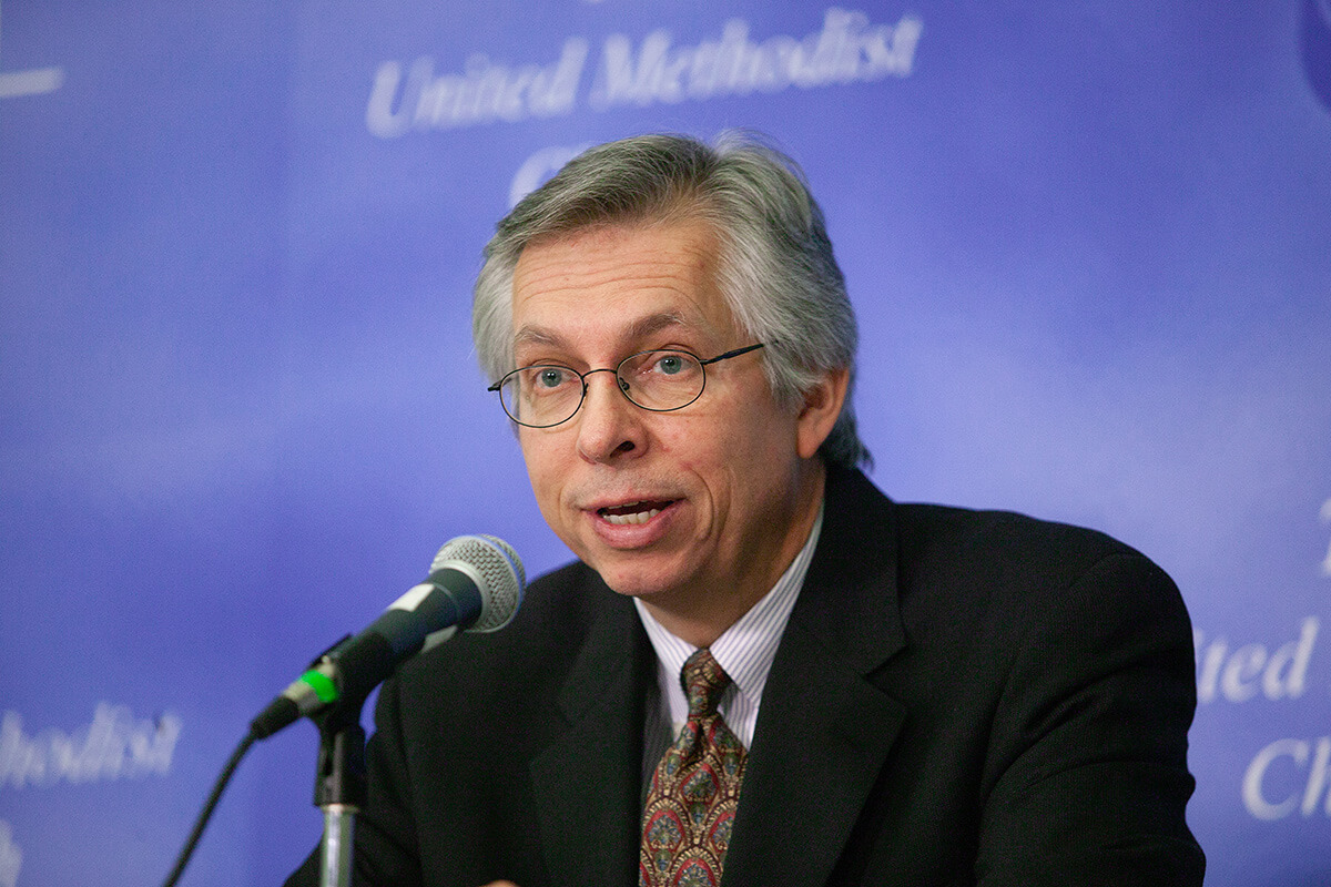 The Rev. Bruce Robbins, former staff executive of the United Methodist Commission on Christian Unity and Interreligious Concerns, speaks during a press conference at the denomination's 2004 General Conference in Pittsburgh. Robbins died Aug. 3. He was 73. File photo by Mike DuBose, UM News. 