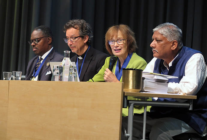 United Methodist Bishop Debra Wallace-Padgett, the newly elected president of the World Methodist Council, leads a meeting of the council delegates Aug. 18, after the conclusion of the World Methodist Conference in Gothenburg, Sweden. Sitting beside Wallace-Padgett are (from left) the Rev. Myron Howie of the African Methodist Episcopal Church and the council’s new treasurer; the Rev. Dr. Reynaldo Leão Neto of the Methodist Church in Britain and the council’s new general secretary, and Joshua Rathnam of The Church of North India and the council’s new vice president. Photo by Heather Hahn, UM News.