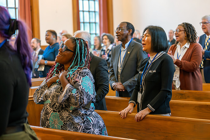 Agency staff and members of the boards of United Methodist Global Ministries and Higher Education and Ministry sing during opening worship at a joint board meeting on Oct. 14 at the Denman Building in Nashville, Tenn. Photo by Adam Bowers, United Methodist Board of Global Ministries.