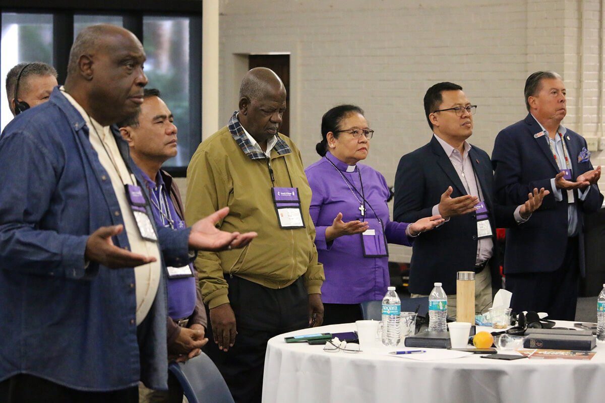 United Methodist bishops from the Philippines, Africa and the U.S. pray during morning worship Nov. 6. The Council of Bishops joined together in worship each day of its Nov. 3-8 meeting at Epworth by the Sea Conference Center on St. Simons Island, Ga. The bishops also took on a number of challenges facing The United Methodist Church. Photo by Rick Wolcott, Council of Bishops.