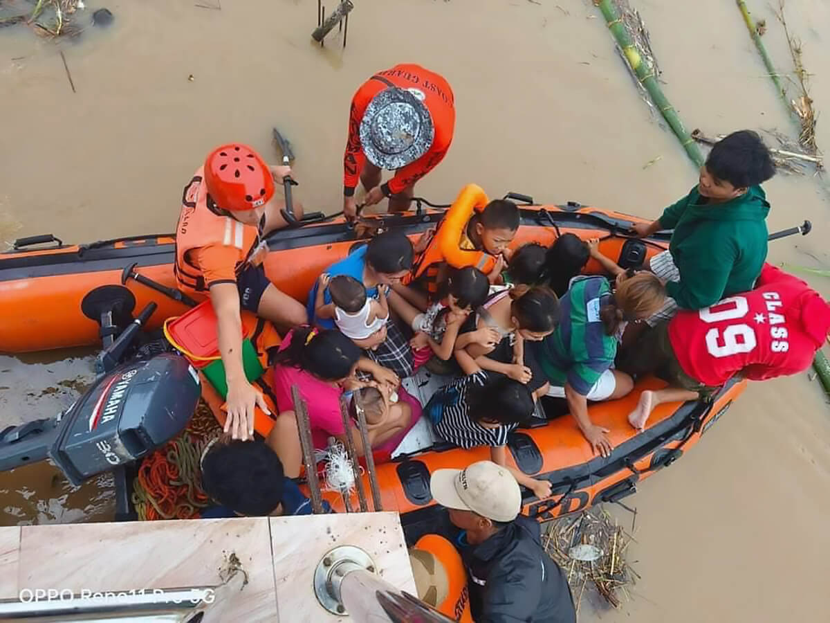 Philippine Coast Guard personnel evacuate residents in the Bicol region on Oct. 24 after floodwaters rose quickly due to heavy rains brought by Tropical Storm Trami (called Kristine in the Philippines). United Methodists are among those rallying to help survivors in the wake of Trami and several other tropical storms that battered the region. Photo courtesy of the Ako Bicol Online TV Facebook page.