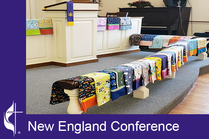 On a blessing Sunday, pillowcases are carefully draped over the alter rail creating a beautiful, bright, & colorful display. The New England Conference Pillowcase Project brings comfort to cancer patients. Photo courtesy of the New England Conference.