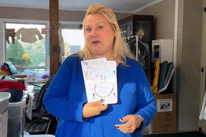 The Rev. Holly Cobb McKim, pastor of Spruce Pine United Methodist Church, reads from a list of encouragement cards sent by Sunday school children following Hurricane Helene. Screengrab by Lilla Marigza, UM News.