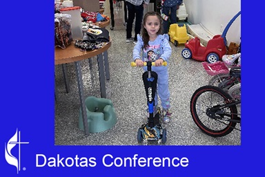A child chooses a scooter at a Kids Free Christmas Shopping event sponsored by ARK and Velva United Methodist churches in North Dakota. Photo courtesy of the Dakotas Conference Facebook page. A child chooses a scooter at a Kids Free Christmas Shopping event sponsored by ARK and Velva United Methodist churches in North Dakota. Photo courtesy of the Dakotas Conference Facebook page.