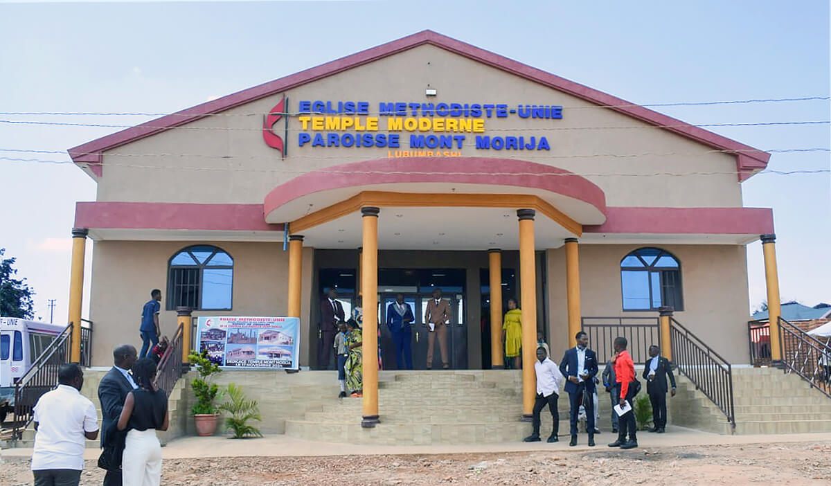 United Methodists stand in front of the new Mont Morija United Methodist Church in Golf Plateau III, a fast-growing district of Lubumbashi, Congo. The new building can accommodate 800 worshippers. Photo courtesy of the Jerusalem District.