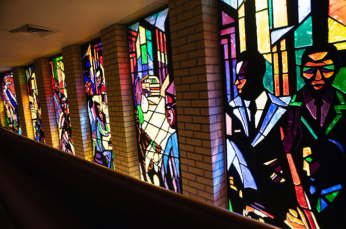 A small sample of the 53 stained-glass windows at St. Luke Community United Methodist Church in Dallas shows the unique style of artist Jean Lacy, who designed these as well as the windows in Trinity United Methodist Church in Houston. The windows at St. Luke were created to represent the heritage, faith and culture of African Americans, for a sanctuary that serves as a center for learning as well as worship. Photo courtesy of St. Luke Community United Methodist Church.