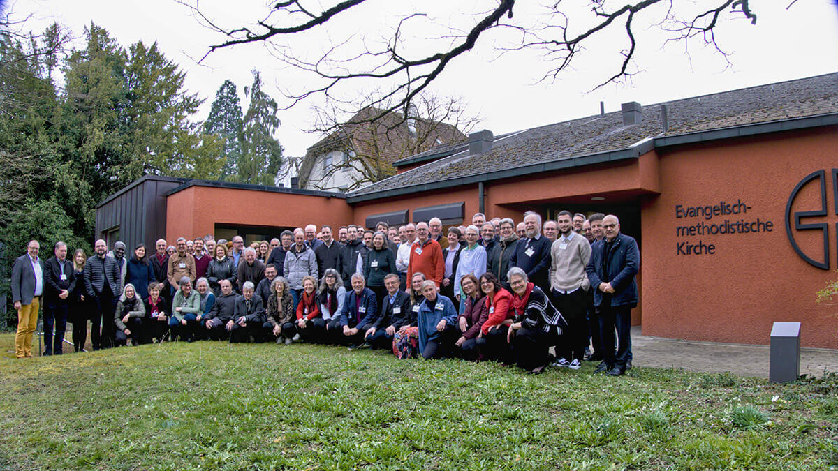 United Methodists at the Central and Southern Europe Central Conference stand together outside Winterthur United Methodist Church in Winterthur, Switzerland, where they met. Photo by the Rev. Jörg Niederer, Central and Southern Europe Central Conference.