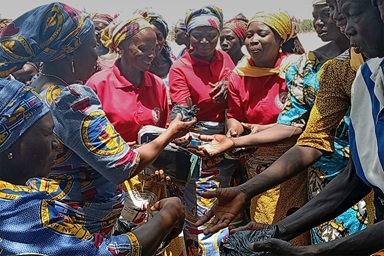 Alice Samuel (second from left), Northern Nigeria Conference women’s coordinator, distributes food during an outreach event in Yapilo Village in the Chonge District of the Shongom Local Government Area of Gombe State on March 29. In addition to providing relief supplies and free medical services, the women preached the Gospel and led prayer sessions in the community. Photo by Ibrahim Babangida, UM News.  Alice Samuel (second from left), Northern Nigeria Conference women’s coordinator, distributes food during an outreach event in Yapilo Village in the Chonge District of the Shongom Local Government Area of Gombe State on March 29. In addition to providing relief supplies and free medical services, the women preached the Gospel and led prayer sessions in the community. Photo by Ibrahim Babangida, UM News.