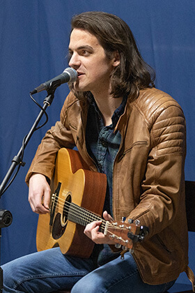 Musician Bay Simpson performs one of his songs during Crafted Conversations at the Singin’ River Brewing Company in Florence, Ala. Photo by Mike DuBose, UM News.