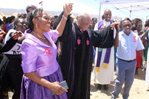 Patricia and Ray Kaukonde join hands with Bishop Eben K. Nhiwatiwa to celebrate the dedication of Donzwe United Methodist Church near Mudzi, Zimbabwe, in December 2024. Ray Kaukonde fulfilled his dying mother’s wish by completing construction of the church that was started in 1977 by his grandfather. Photo by Kudzai Chingwe, UM News. Patricia and Ray Kaukonde join hands with Bishop Eben K. Nhiwatiwa to celebrate the dedication of Donzwe United Methodist Church near Mudzi, Zimbabwe, in December 2024. Ray Kaukonde fulfilled his dying mother’s wish by completing construction of the church that was started in 1977 by his grandfather. Photo by Kudzai Chingwe, UM News.