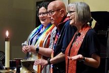 Reinstated clergy members the Revs. Beth Stroud (left), Deen Thompson and Susan Morgan serve communion at a May 1 celebration of full inclusion for LGBTQ persons in The United Methodist Church. The event was at Dallas’ Greenland Hills United Methodist Church. Photo by Sam Hodges, UM News. Reinstated clergy members the Revs. Beth Stroud (left), Deen Thompson and Susan Morgan serve communion at a May 1 celebration of full inclusion for LGBTQ persons in The United Methodist Church. The event was at Dallas’ Greenland Hills United Methodist Church. Photo by Sam Hodges, UM News.