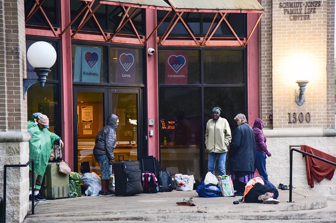 Unhoused women wait for the doors to open on the morning of March 28 at First United Methodist Church of Austin, Texas. Each Friday, the women are able to get showers, pick out new clothing from donations the church has collected, have a meal or enjoy the luxury of sleeping in a safe environment. Once a month, they can get their hair washed, cut and styled. Photo by Andrea Turner, UM News. Unhoused women wait for the doors to open on the morning of March 28 at First United Methodist Church of Austin, Texas. Each Friday, the women are able to get showers, pick out new clothing from donations the church has collected, have a meal or enjoy the luxury of sleeping in a safe environment. Once a month, they can get their hair washed, cut and styled. Photo by Andrea Turner, UM News.