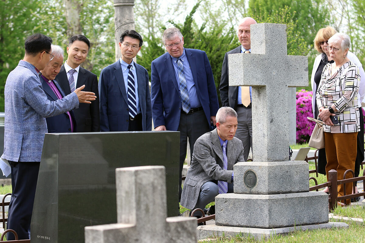 Bishop Hee-Soo Jung (second from left) and leaders from the Ohio Episcopal Area visit Yanghwajin Foreign Missionary Cemetery on April 23 in Seoul, South Korea, for the unveiling ceremony of a memorial stone honoring missionaries William Scranton, and his mother, Mary Scranton, who are buried in the cemetery. Photo by the Rev. Thomas E. Kim, UM News.