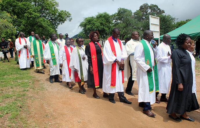 Clergy attend the dedication of Chindenga rural health clinic in Mutoko, Zimbabwe, on Feb. 22. It is the sixth health clinic under United Methodist Nyadire Mission Hospital that has been revitalized by United Methodists over the past decade. Photo by Kudzai Chingwe, UM News.