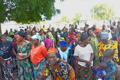 Community members affected by a violent attack in Karim Lamido, Nigeria, gather to receive aid from The United Methodist Church on June 4. The Nigeria Episcopal Area provided food, bedding and other supplies to survivors of the attack on local farmers, which left more than 40 dead, including 24 United Methodists. Photo by the Rev. Filibus Bakari Auta, UM News.  Community members affected by a violent attack in Karim Lamido, Nigeria, gather to receive aid from The United Methodist Church on June 4. The Nigeria Episcopal Area provided food, bedding and other supplies to survivors of the attack on local farmers, which left more than 40 dead, including 24 United Methodists. Photo by the Rev. Filibus Bakari Auta, UM News.