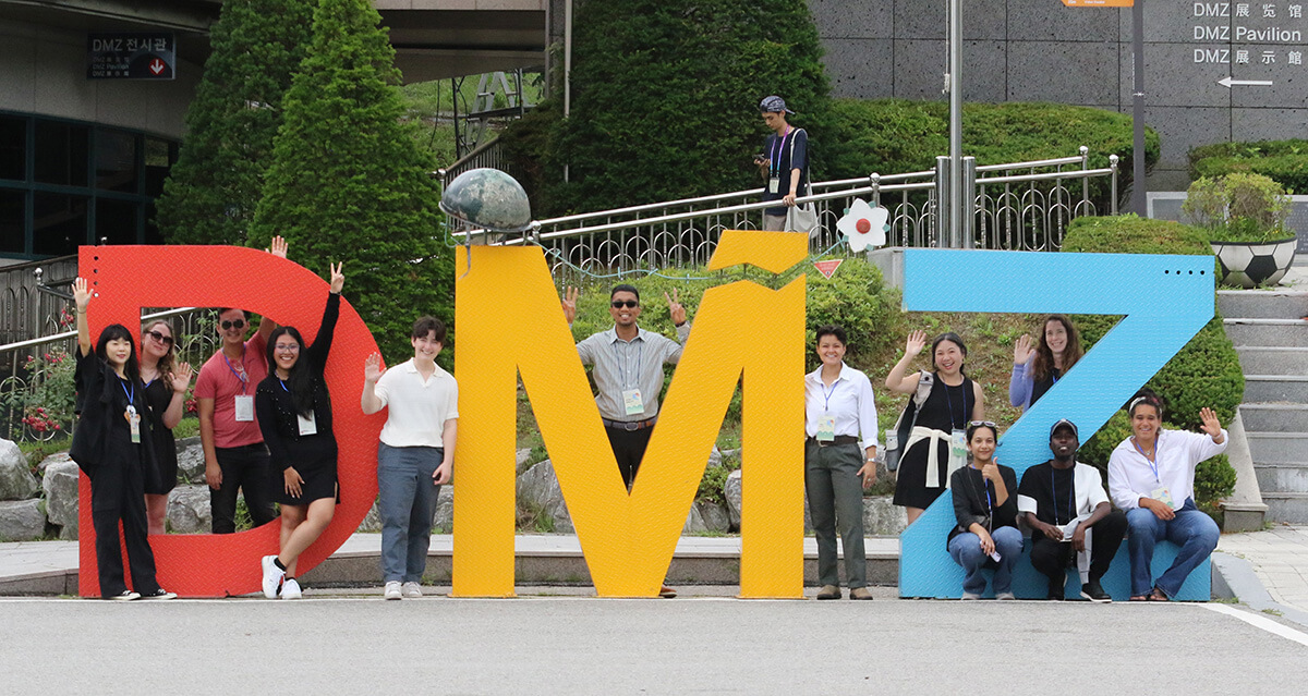 Young adults pose for a photo during a visit to the Demilitarized Zone in Paju, Korea, on June 24. The group traveled from 15 countries to participate in the 2025 Young Adults Pilgrimage of Peace in South Korea, organized in part by United Methodists. Photo by the Rev. Thomas E. Kim, UM News.