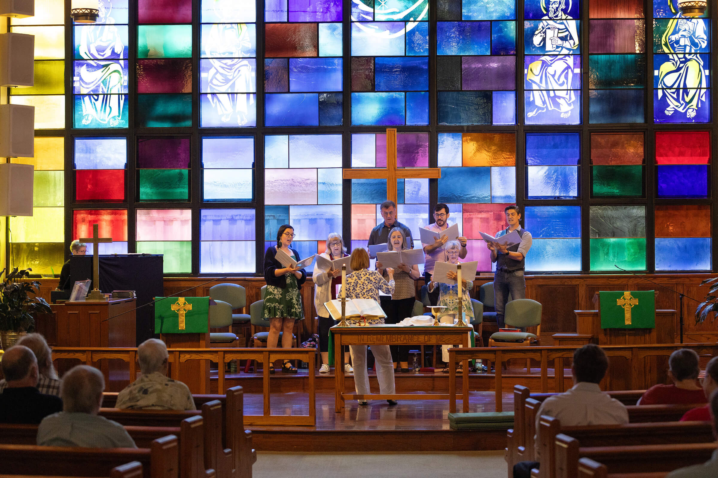 Sunlight streams through the stained-glass windows as the choir sings during worship at St. Luke’s United Methodist Church in New Orleans in July 2025. Photo by Mike DuBose, UM News.