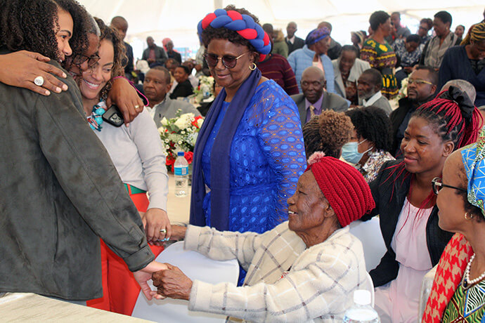 From left, Tanyaradzwa Kajese, Bishop Malusi Mpumlwana, Tinashe Kajese, Caroline June Kajese, Janet Gowe and Thoko Mpumlwana catch up following the dedication of Hoyuyu United Methodist Church’s Nzira Sanctuary in May. Photo by Kudzai Chingwe, UM News.