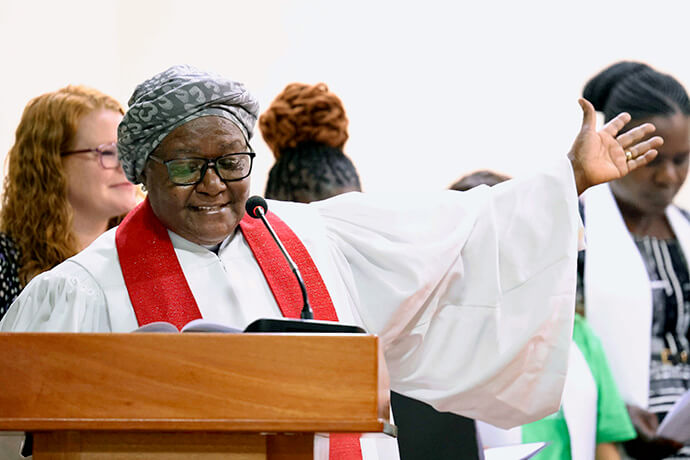 Retired Bishop Joaquina F. Nhanala offers a blessing and formally presents the newly consecrated deaconesses and home missioners to be received by the diaconal members present on behalf of The United Methodist Church in Moshi, Tanzania. Fifteen candidates were consecrated during the service. Photo by Gad Maiga, UM News.