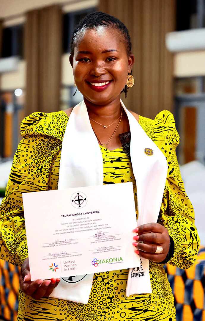 Deaconess Taurai Sandra Chinyerere of the Zimbabwe West Conference holds her certificate of consecration during the Africa Region Deaconess/Home Missioner service on July 9 in Moshi, Tanzania. Photo by Gad Maiga, UM News.