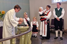 Bishop Knut Refsdal, who leads the Nordic-Baltic-Ukraine Area, baptizes Aksel, as the baby’s parents, Håkon and Astri Helen Madland, look on. The newly elected bishop chose Flekkefjord, Norway, as his first visit in a strong sign of solidarity with the United Methodists there. Photo by Karl Anders Ellingsen, UM News. Bishop Knut Refsdal, who leads the Nordic-Baltic-Ukraine Area, baptizes Aksel, as the baby’s parents, Håkon and Astri Helen Madland, look on. The newly elected bishop chose Flekkefjord, Norway, as his first visit in a strong sign of solidarity with the United Methodists there. Photo by Karl Anders Ellingsen, UM News.