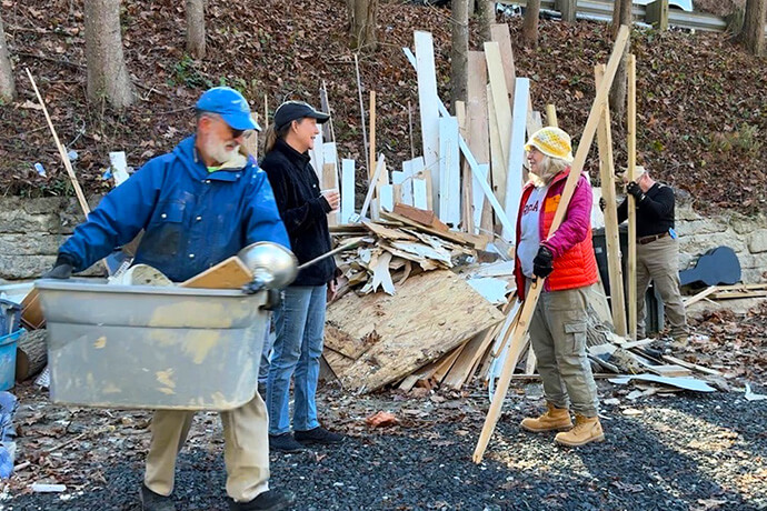 Members of Floris United Methodist Church help Barbara Douglas remove debris from her home in Spruce Pine, N.C., following Hurricane Helene. Video image by Lilla Marigza, UM News.