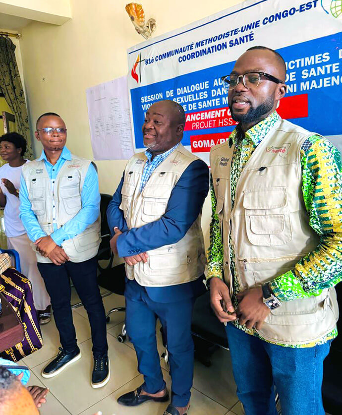 Dr. Damas Lushima (right), coordinator for the East Congo Episcopal Area health board, stands with other facilitators at a dialogue session in Goma for women affected by sexual violence. The workshops are part of a church program supported by the United Methodist Board of Global Ministries’ Global Health unit. Photo courtesy of the East Congo Episcopal Area health board.