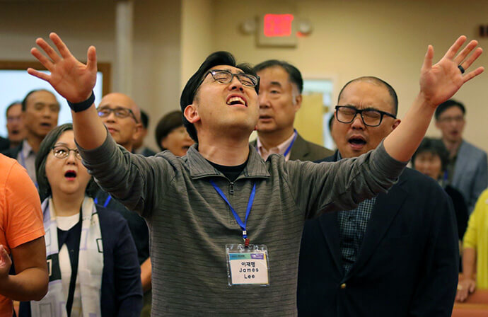 The Rev. James Jaemyung Lee sings praise during the evening worship on the second day of the Korean Association of The United Methodist Church, held Sept. 30. Photo by the Rev. Thomas E. Kim, UM News.