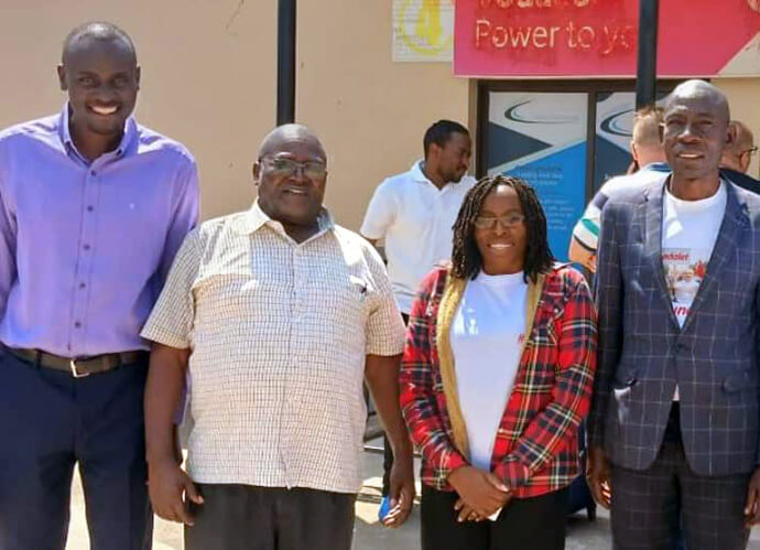 From left, Mwanza District Superintendent Weekend Juma, the Rev. Abisay Lameck Juwakali, the Rev. Rebecca Maiko and Stiven Seif Maruhani, Mwanza District lay leader, stand for a group photo. Maiko, who worked closely with Juwakali, is committed to maintaining his holistic vision for the Mwanza Mission Center. Photo courtesy of the Rev. Rebecca Maiko.