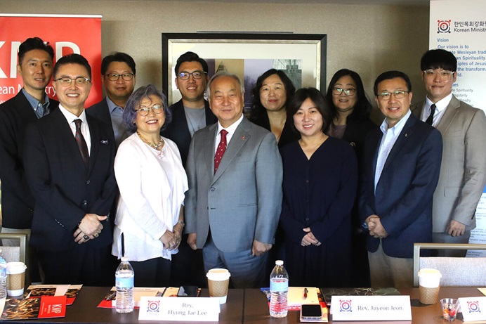 Leaders of the Korean Ministry Plan stand together on the first day of their meeting, held Oct. 2-4 in Teaneck, New Jersey. (Front row, from left) the Rev. Paul H. Chang, Susan Kim, Bishop Hee-Soo Jung, the Revs. Ju-Yeon Jeon and Jae Lee; (back row, from left) the Revs. Hongyun Won, Hyok In Kwon, James Jaemyung Lee, Miso Park, Prumeh Lee and Ji Min Bang. Photo by the Rev. Thomas E. Kim, UM News. Leaders of the Korean Ministry Plan stand together on the first day of their meeting, held Oct. 2-4 in Teaneck, New Jersey. (Front row, from left) the Rev. Paul H. Chang, Susan Kim, Bishop Hee-Soo Jung, the Revs. Ju-Yeon Jeon and Jae Lee; (back row, from left) the Revs. Hongyun Won, Hyok In Kwon, James Jaemyung Lee, Miso Park, Prumeh Lee and Ji Min Bang. Photo by the Rev. Thomas E. Kim, UM News.