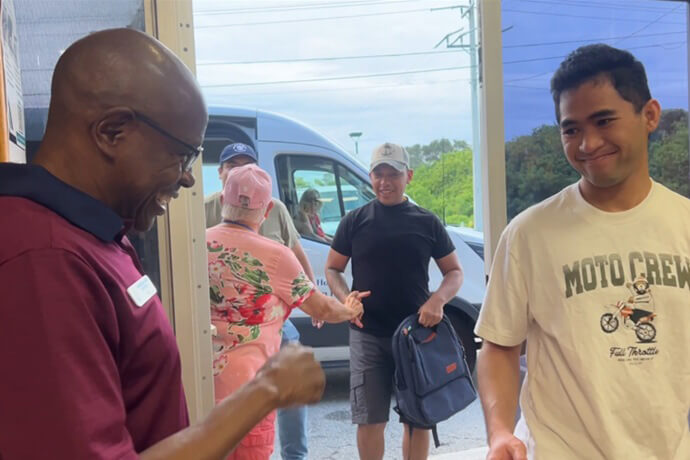 Volunteers with the Canaveral Port Ministry welcome cruise ship workers on leave while their ships are docked in Port Canaveral, Fla. The ministry provides respite for homesick seafarers far from their home countries. Video image by Lilla Marigza, UM News.
